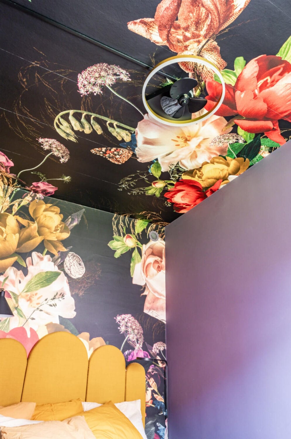 A Vibrant, Colorful Midcentury Apartment in Malmö 18 bedroom with floral mural up to the ceiling