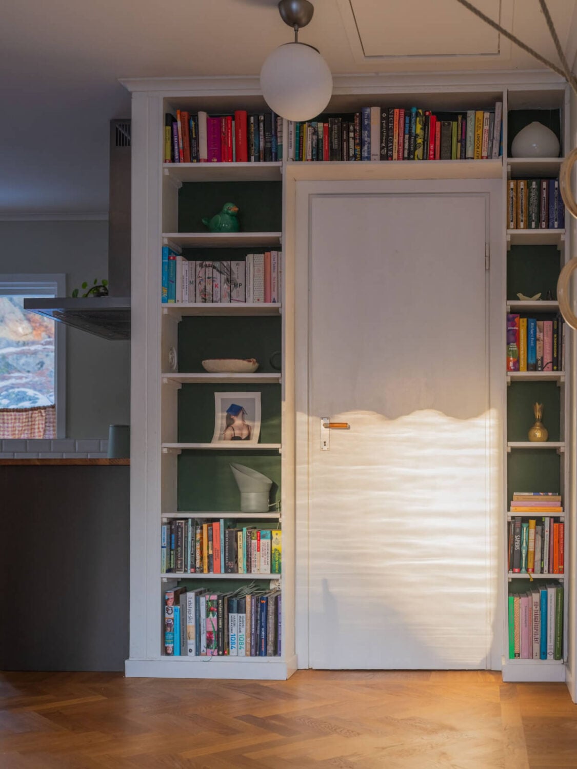 A Beautiful Midcentury Family Home South of Stockholm 6 bookshelves around door