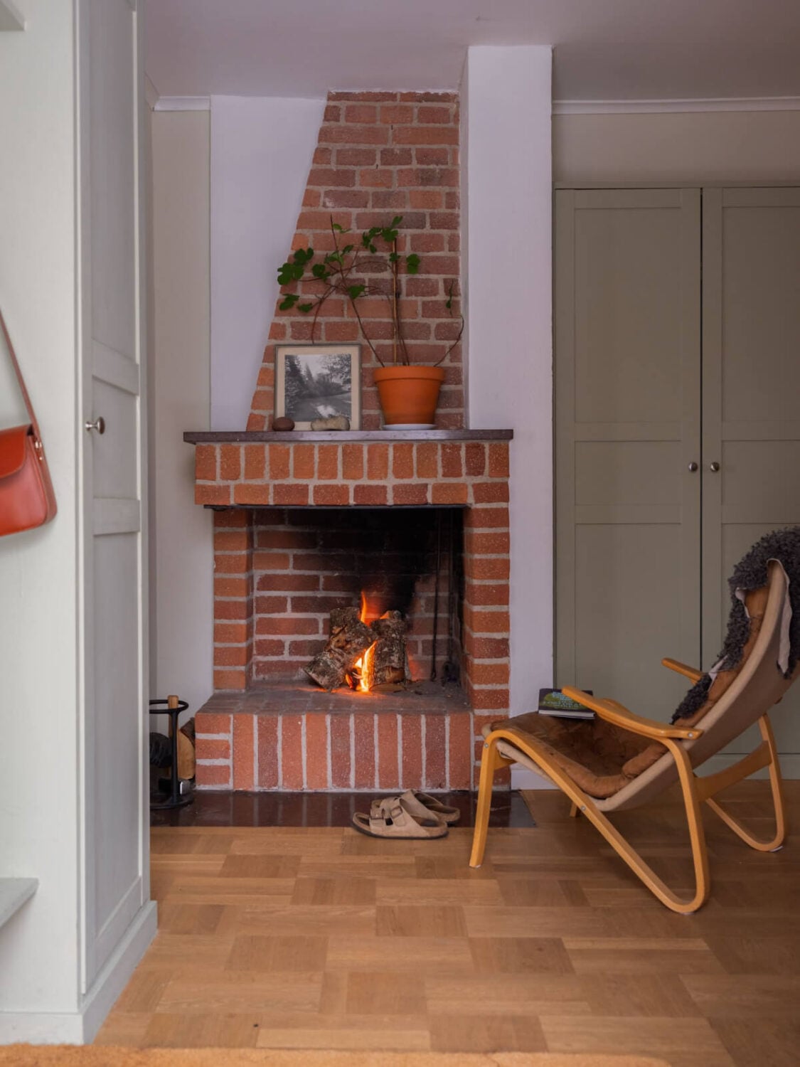 A Beautiful Midcentury Family Home South of Stockholm 28 brick fireplace in hallway