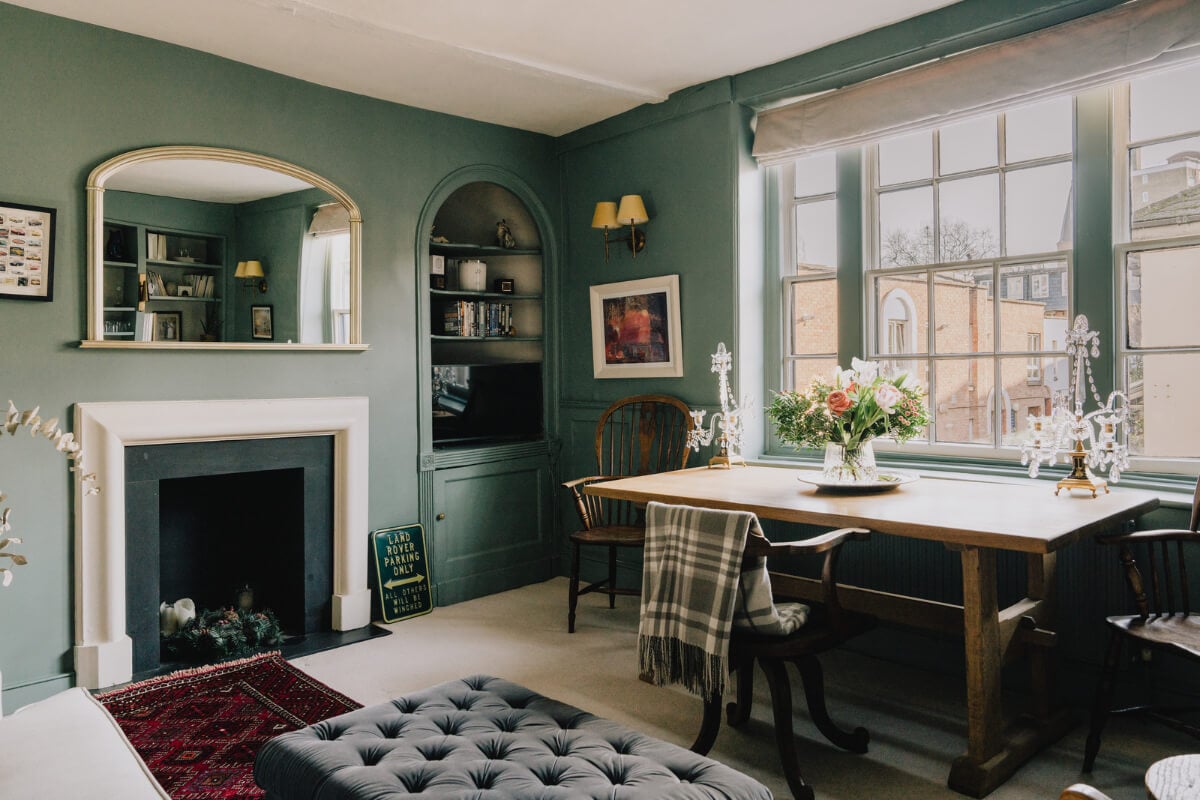 Countryside Charm in a London Apartment in a Former Ale House 4 charming green living room with arched built in bookcase and wooden table