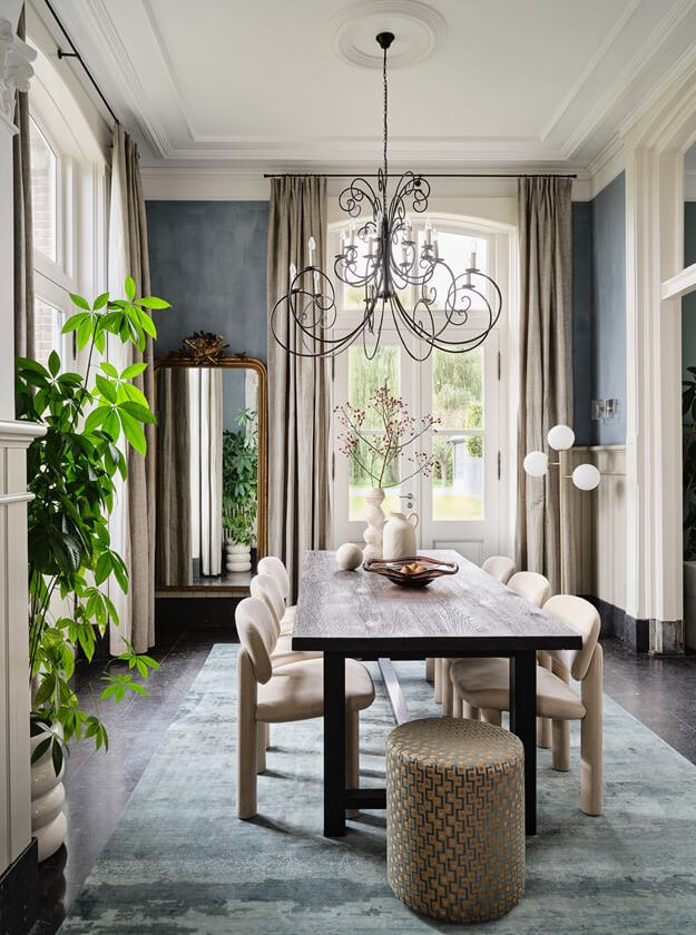 An Amazing Family Home in a Former Dutch Train Station 2 classic dining room with high ceiling and rug