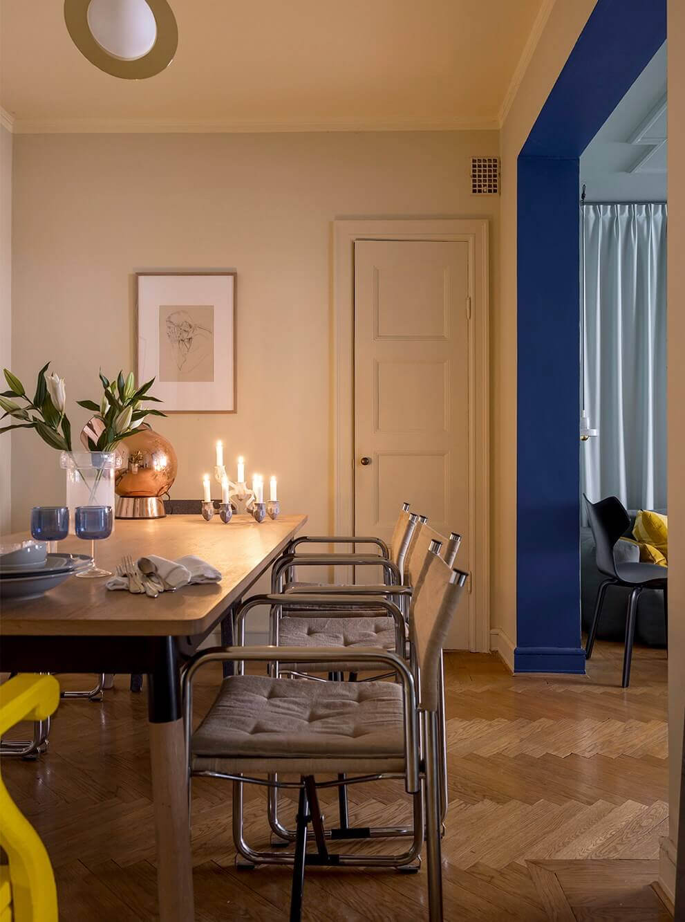 An Interior Designer's Moody Apartment with Period Features 6 cozy dining room and kobalt blue doorway