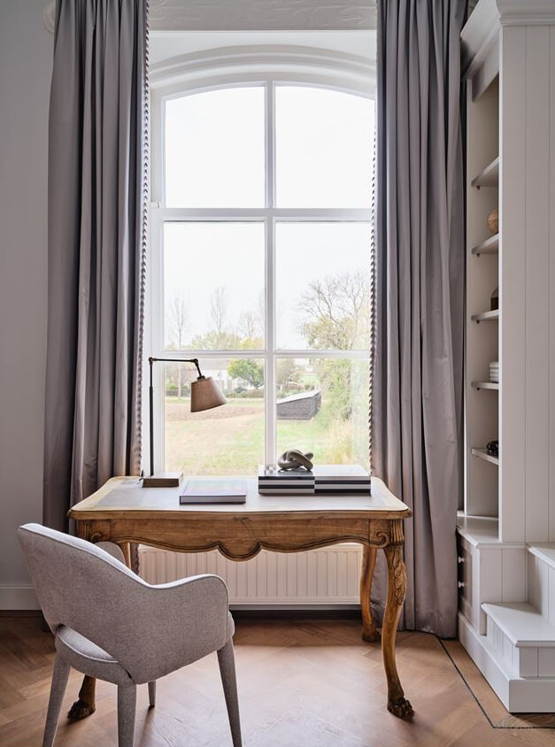 An Amazing Family Home in a Former Dutch Train Station 16 desk in front of the window