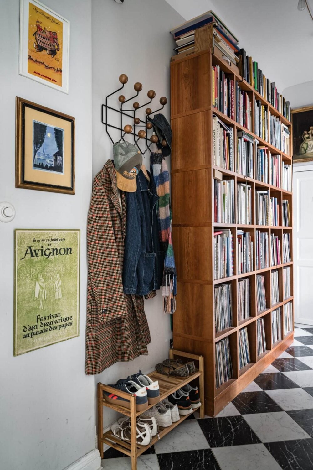 Muted Tones, Art, and Books in a Charming Stockholm Apartment 17 entry hall with coat and shoe storage and bookcases