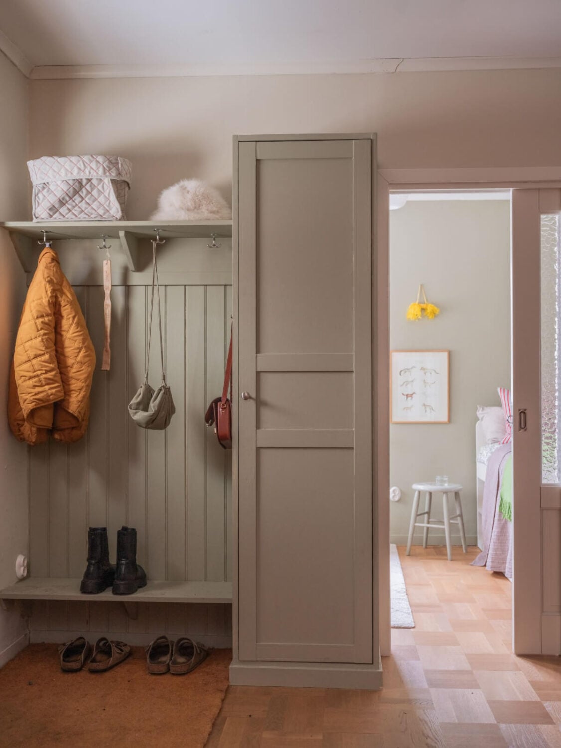 A Beautiful Midcentury Family Home South of Stockholm 29 entry with coat and shoe storage built in wardrobe