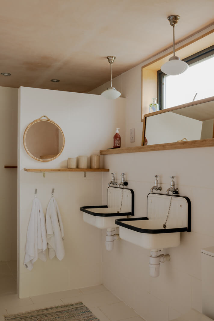 A Strong Color Palette in a Unique Country House in Cornwall 26 garden studio bathroom with double sinks
