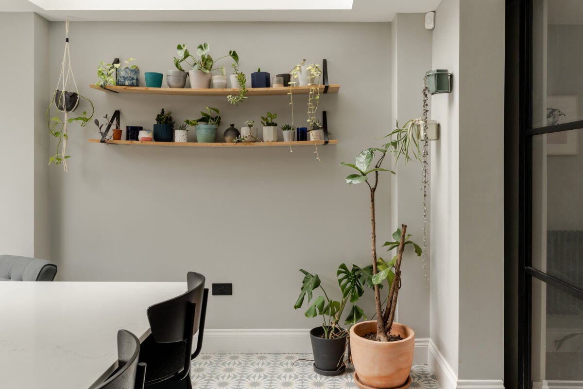 A Beautiful Extended Victorian Family Home in London 5 gray dining room with wooden shelves