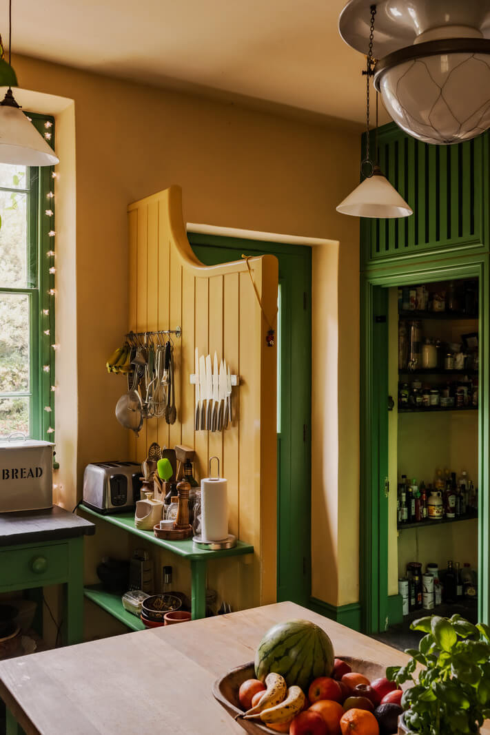 A Strong Color Palette in a Unique Country House in Cornwall 3 green and yellow kitchen in english home