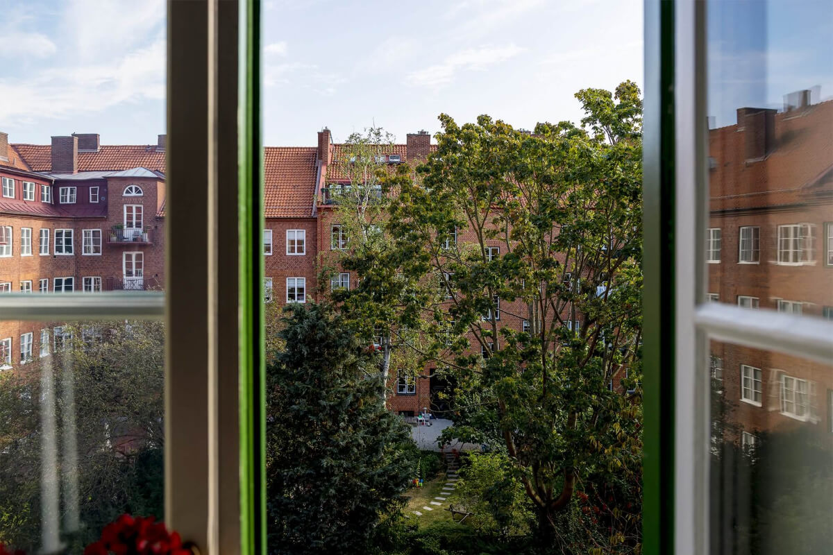A Spacious Nordic Apartment with a Wonderful Color Palette 12 green courtyard garden