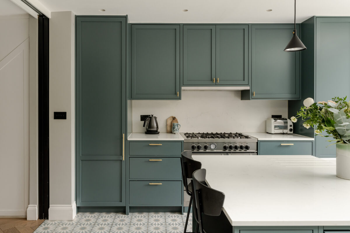 A Beautiful Extended Victorian Family Home in London 4 green kitchen with brass handles