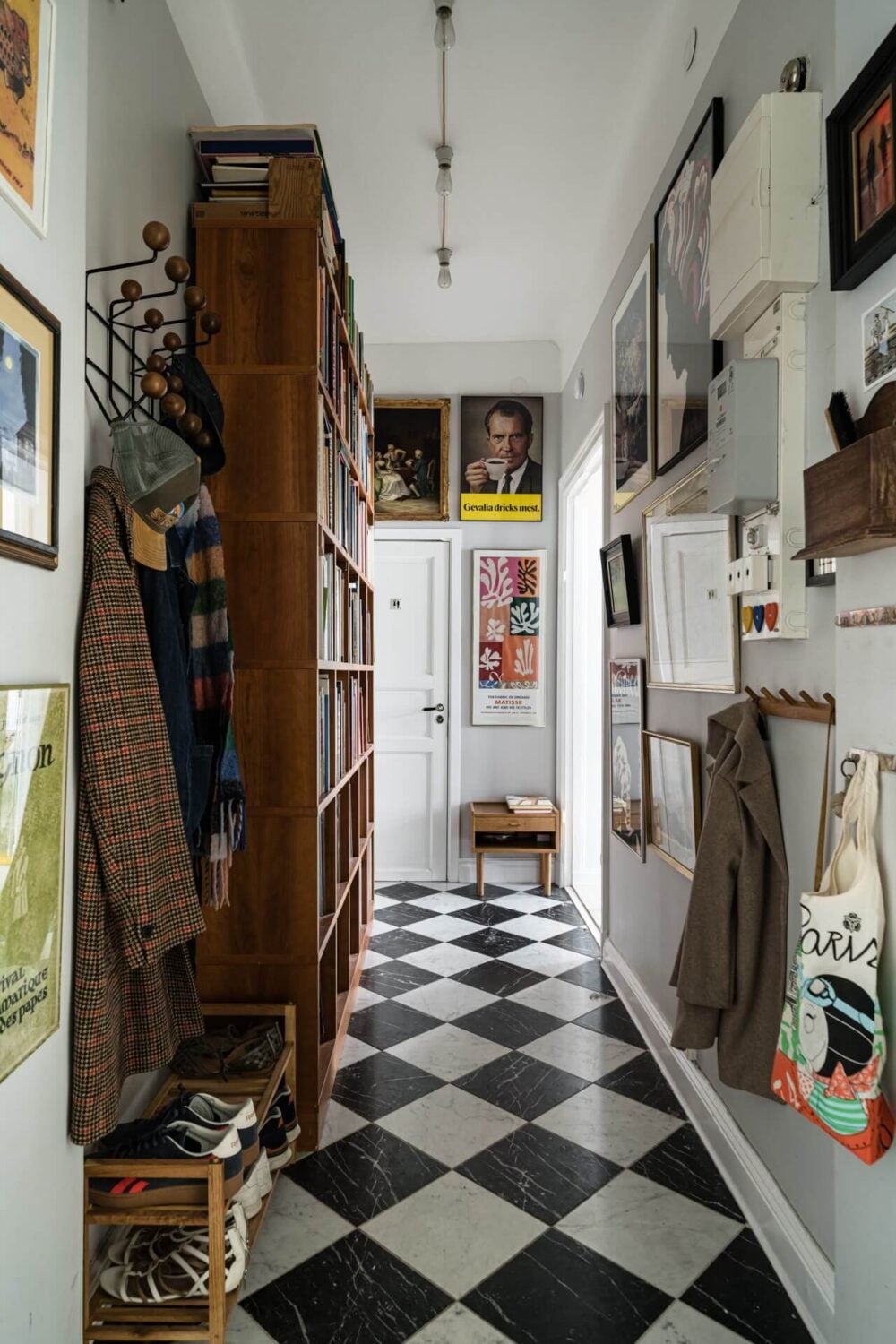 Best of 2025: Hallways 21 hall with checkerboard marble floor tiles bookcases and art
