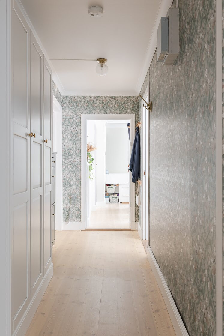 A Small and Bright Two-Bedroom Apartment in Stockholm 24 hallway with built in cabinets and wallpaper A Small and Bright Two-Bedroom Apartment in Stockholm