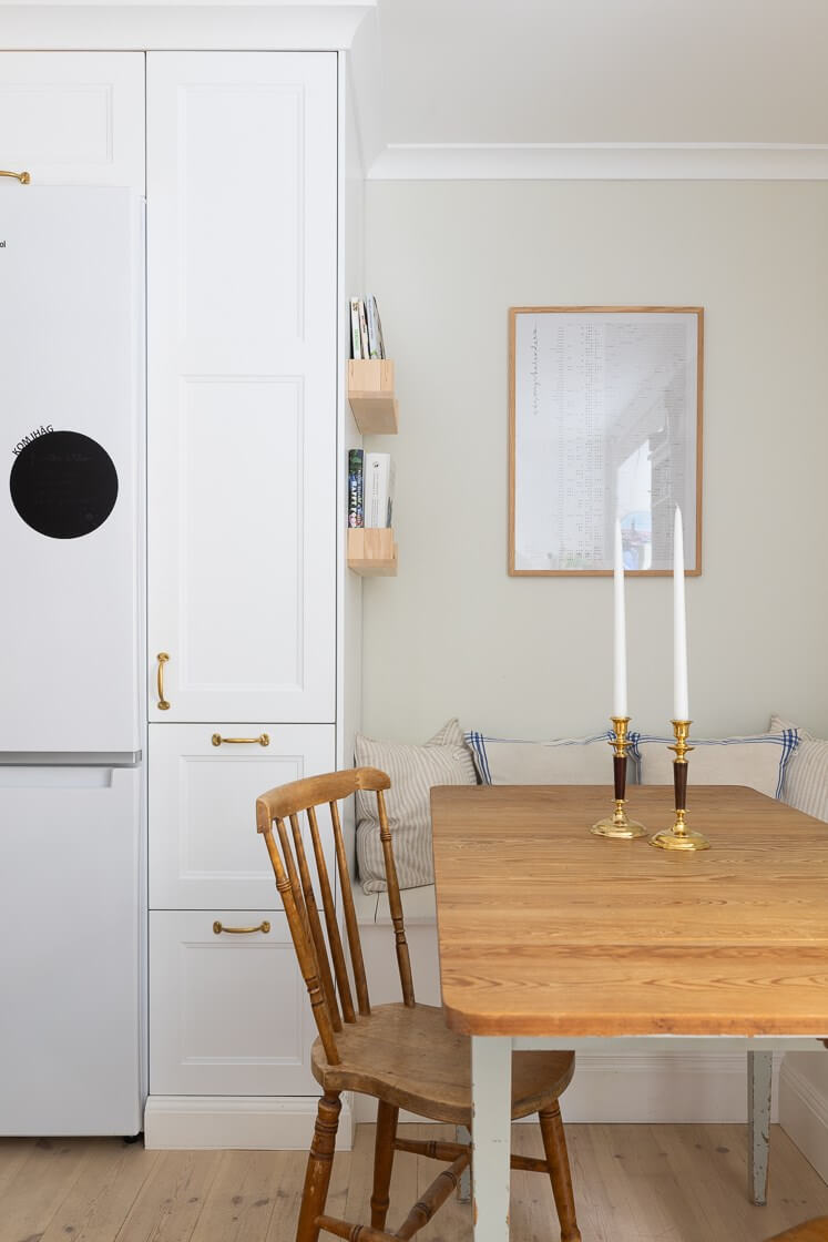 A Small and Bright Two-Bedroom Apartment in Stockholm 17 kitchen table with built in bench