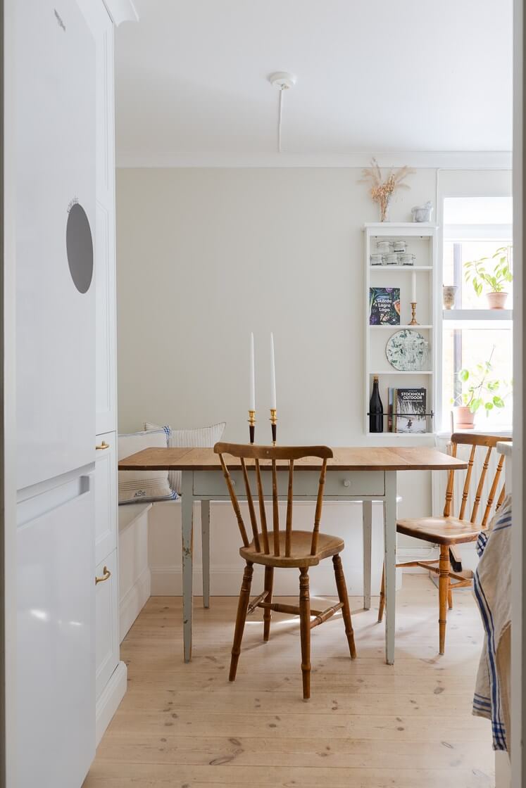 A Small and Bright Two-Bedroom Apartment in Stockholm 11 kitchen table with corner bench