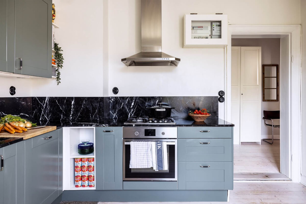 A Spacious Nordic Apartment with a Wonderful Color Palette 16 kitchen with black marble countertop nordroom
