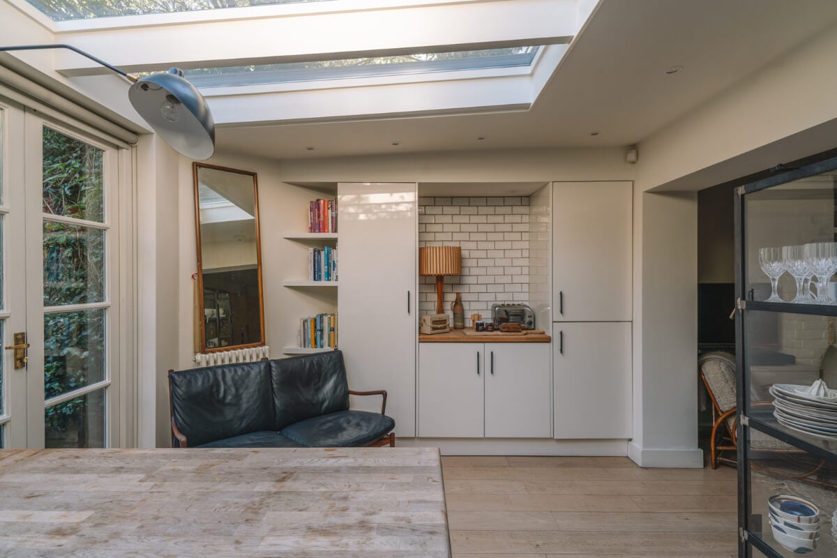 A Charming Garden Apartment in North Kensington 11 kitchen with black sofa