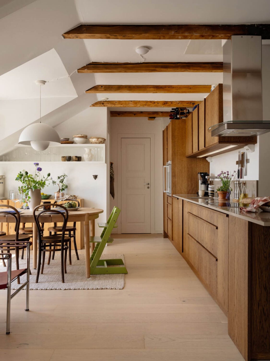 Best of 2025: Kitchens 90 kitchen with dining table in stockholm attic apartment