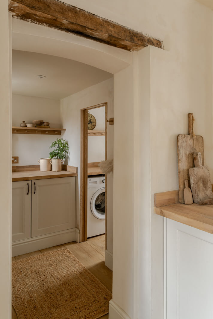 A Light Rustic Farmhouse-Style in an English Cottage 16 kitchen with exposed wooden beam and utility room nordroom