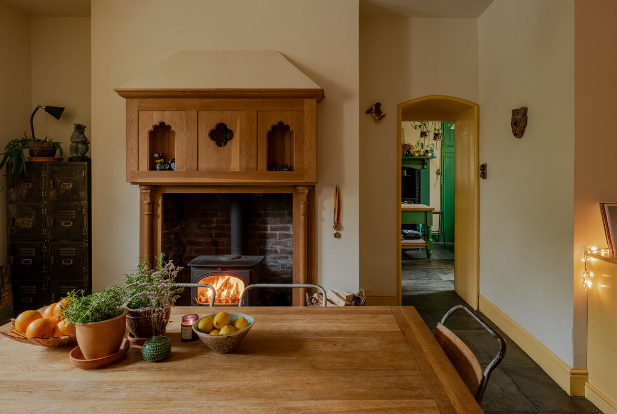 A Strong Color Palette in a Unique Country House in Cornwall 9 kitchen with log burner
