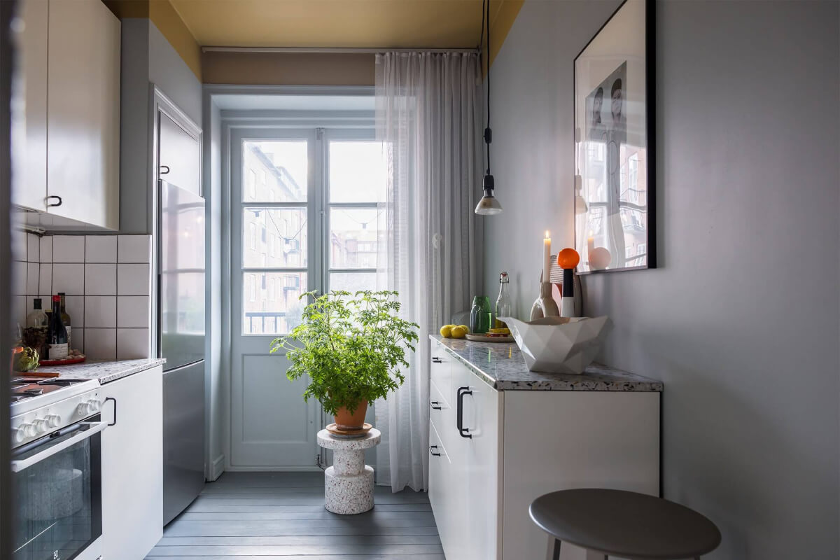 An Interior Designer's Moody Apartment with Period Features 18 kitchen with ochre yellow ceiling