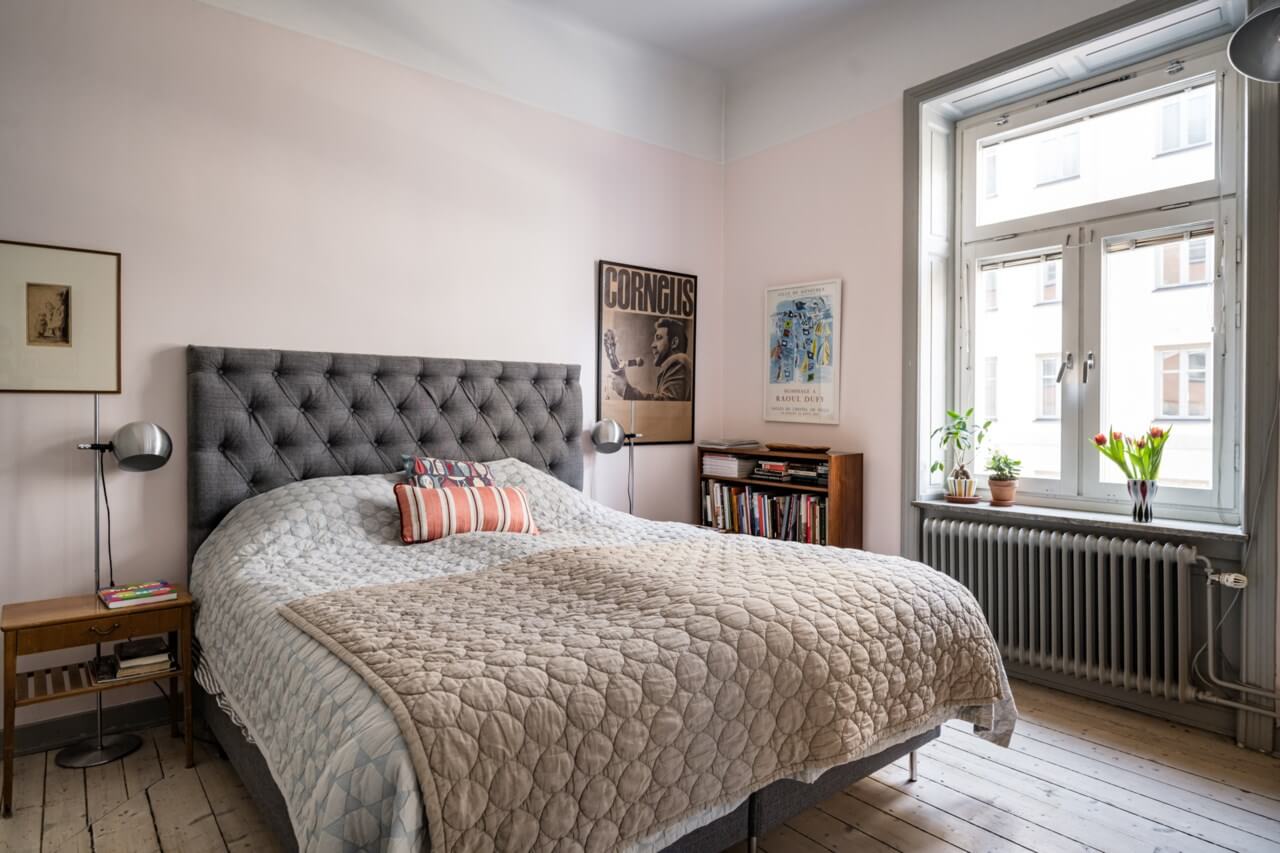 Muted Tones, Art, and Books in a Charming Stockholm Apartment 12 light pink and gray bedroom