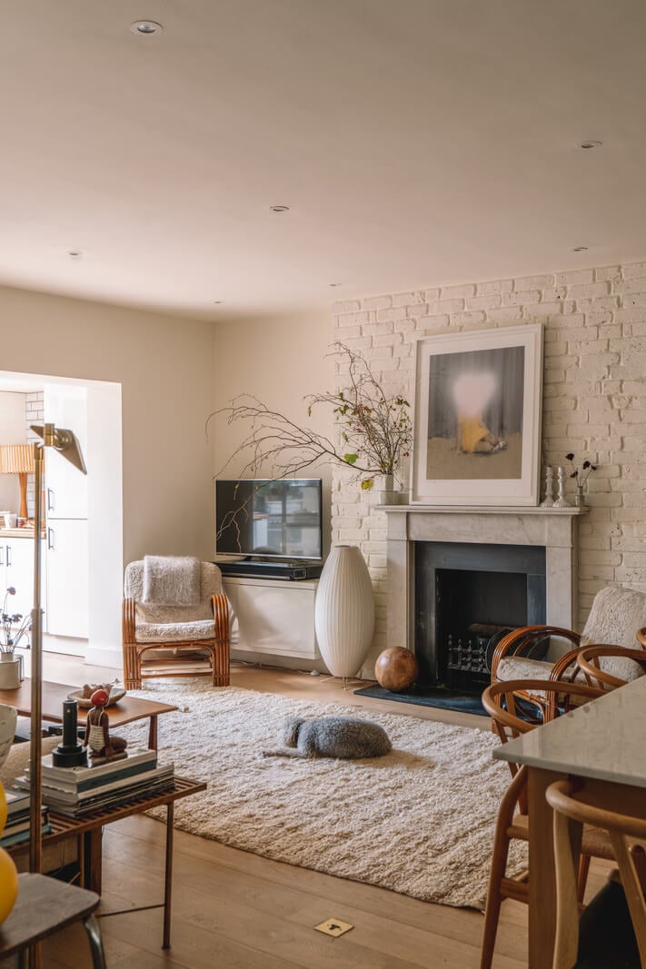 A Charming Garden Apartment in North Kensington 2 living room centered around fireplace