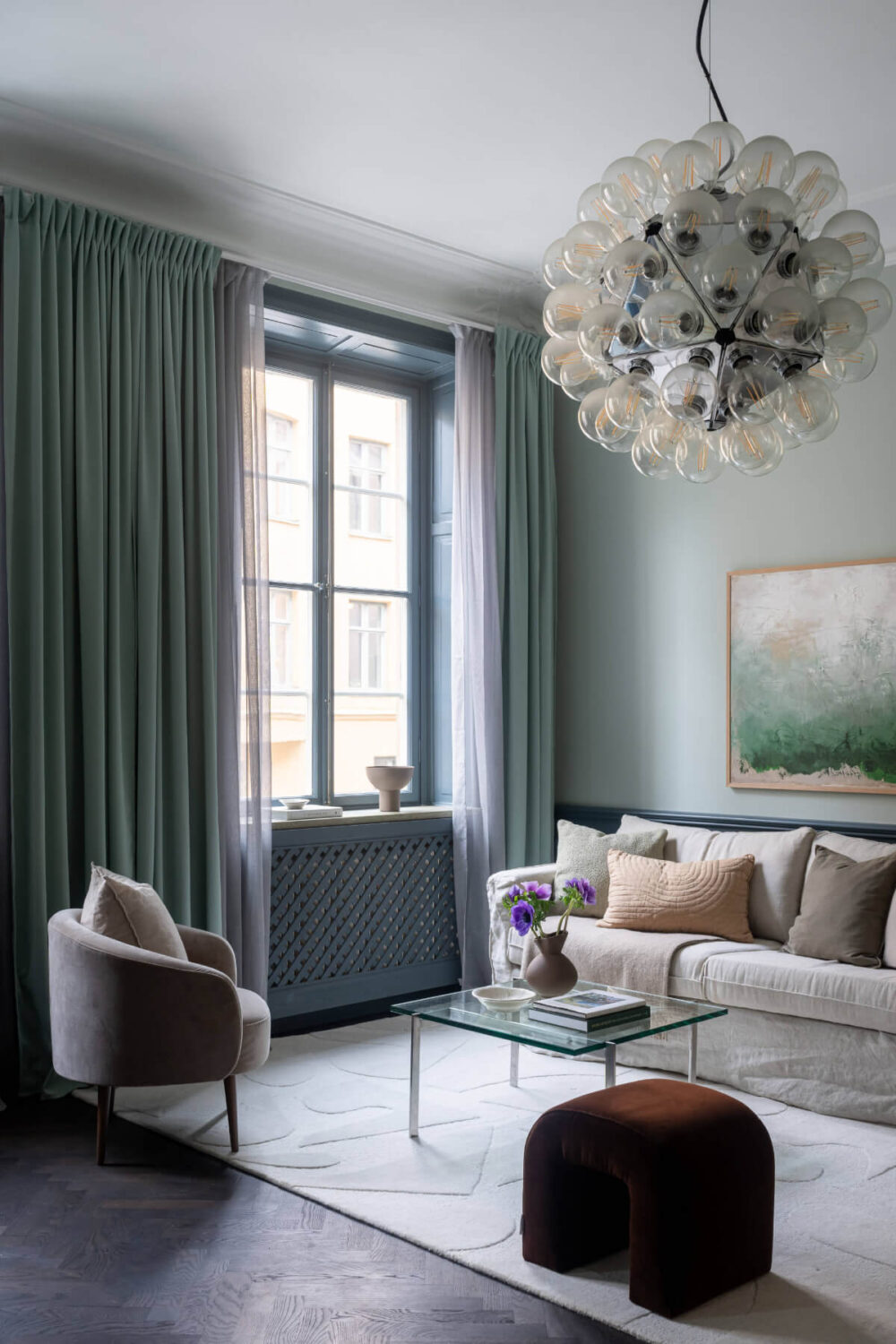 A Moody Color Palette in a Stylish One-Bedroom Apartment in Stockholm 2 living room muted color palette nordroom