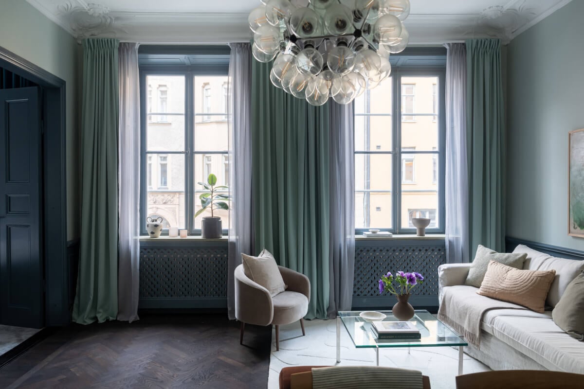 A Moody Color Palette in a Stylish One-Bedroom Apartment in Stockholm 3 living room painted in muted moody colors nordroom