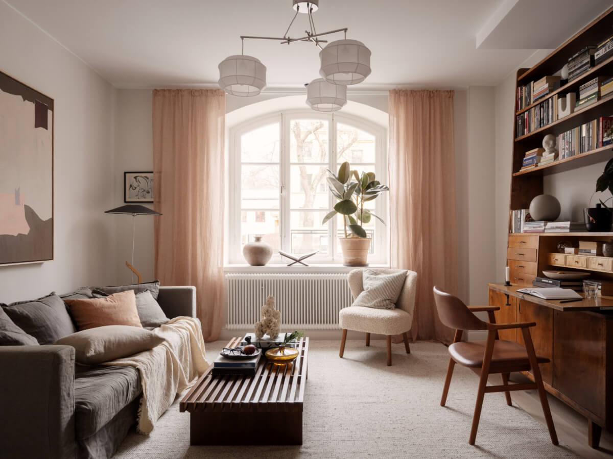 A Calm and Contemporary Apartment in a Former Office Space 1 living room with arched windows and neutral textile colors