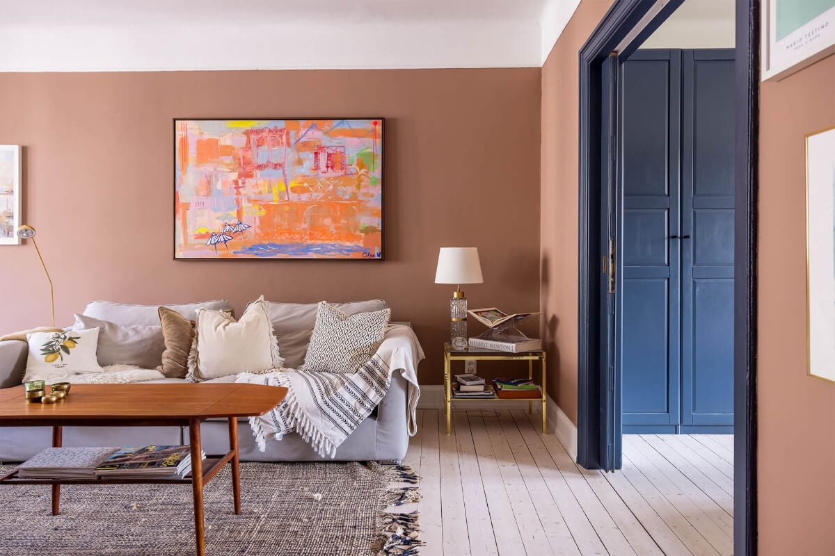 A Spacious Nordic Apartment with a Wonderful Color Palette 8 living room with earthy pink wall color and wooden floor nordroom