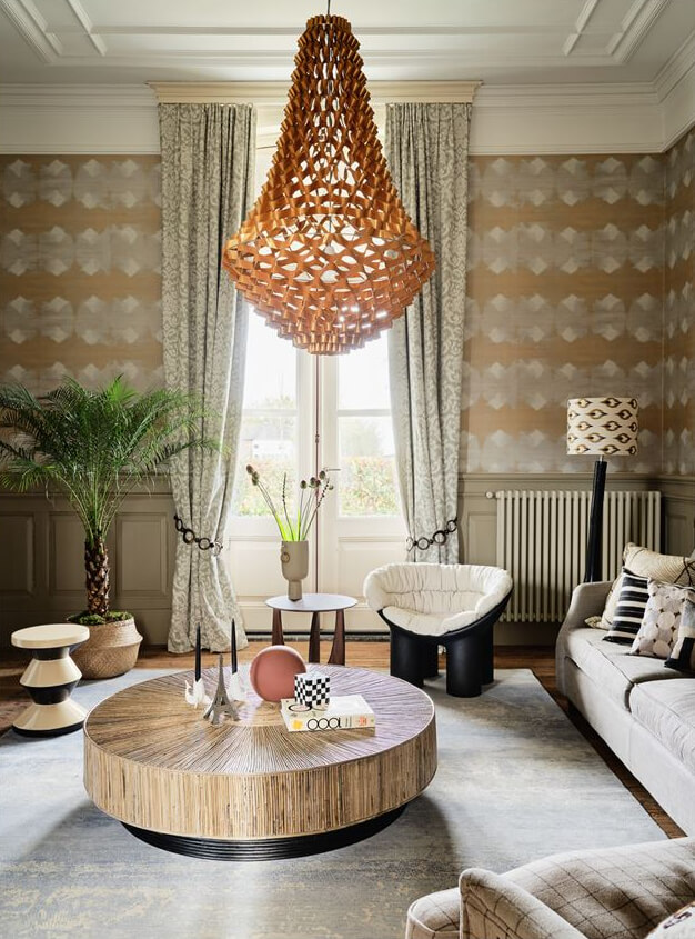 An Amazing Family Home in a Former Dutch Train Station 5 living room with period features wallpaper large chandelier and round coffee table nordroom