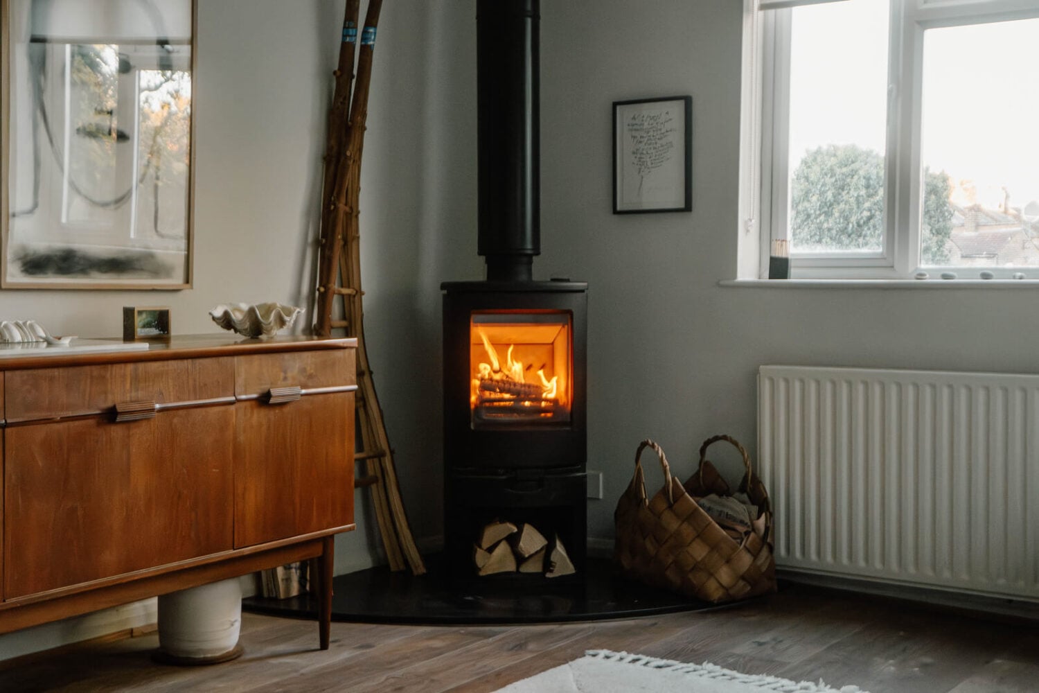 French and Midcentury Influences in a Charming London Studio Apartment 6 log burner in tiny house