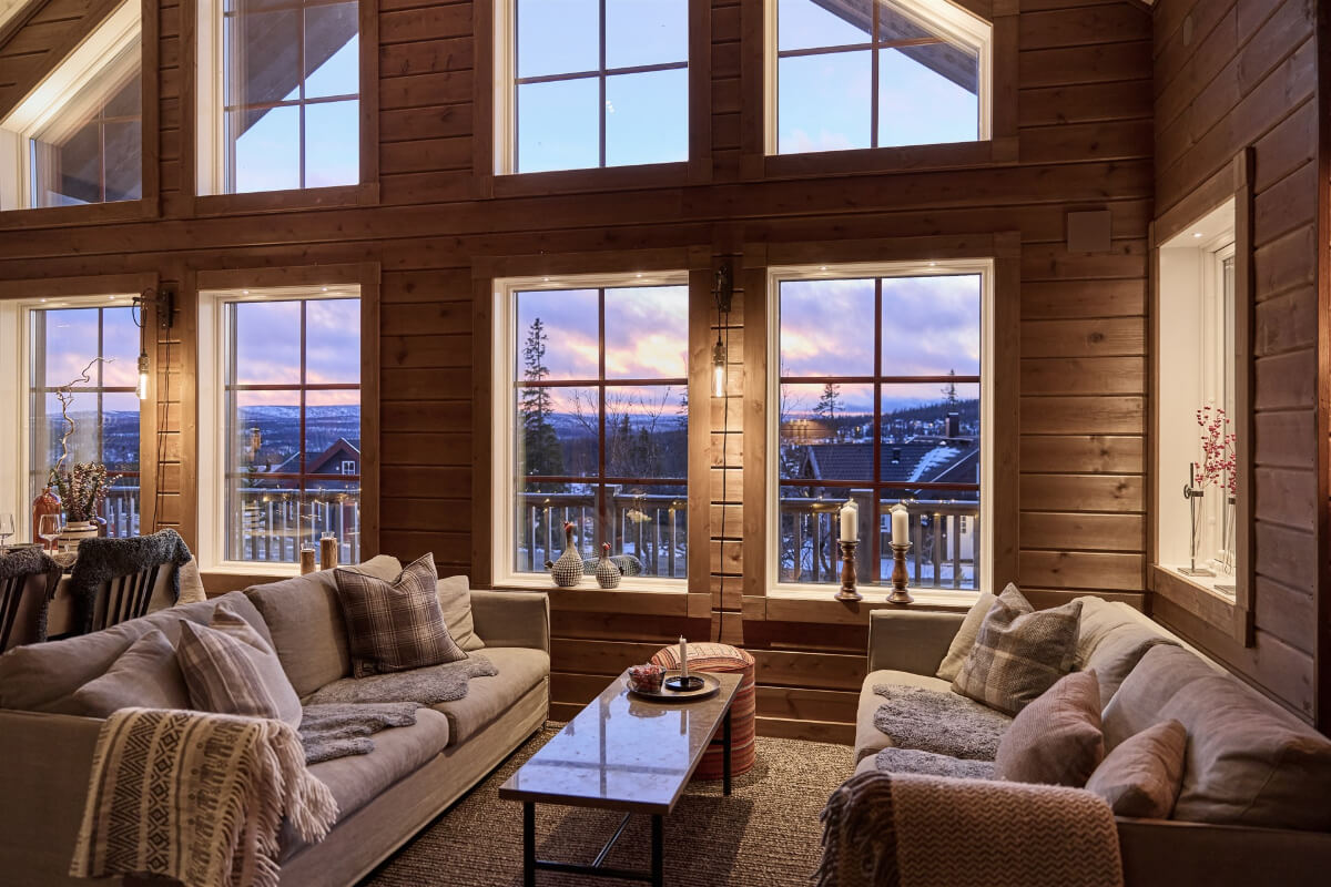 A Warm and Inviting Mountain House in Sweden 5 log house living room at night A Warm and Inviting Mountain House in Sweden