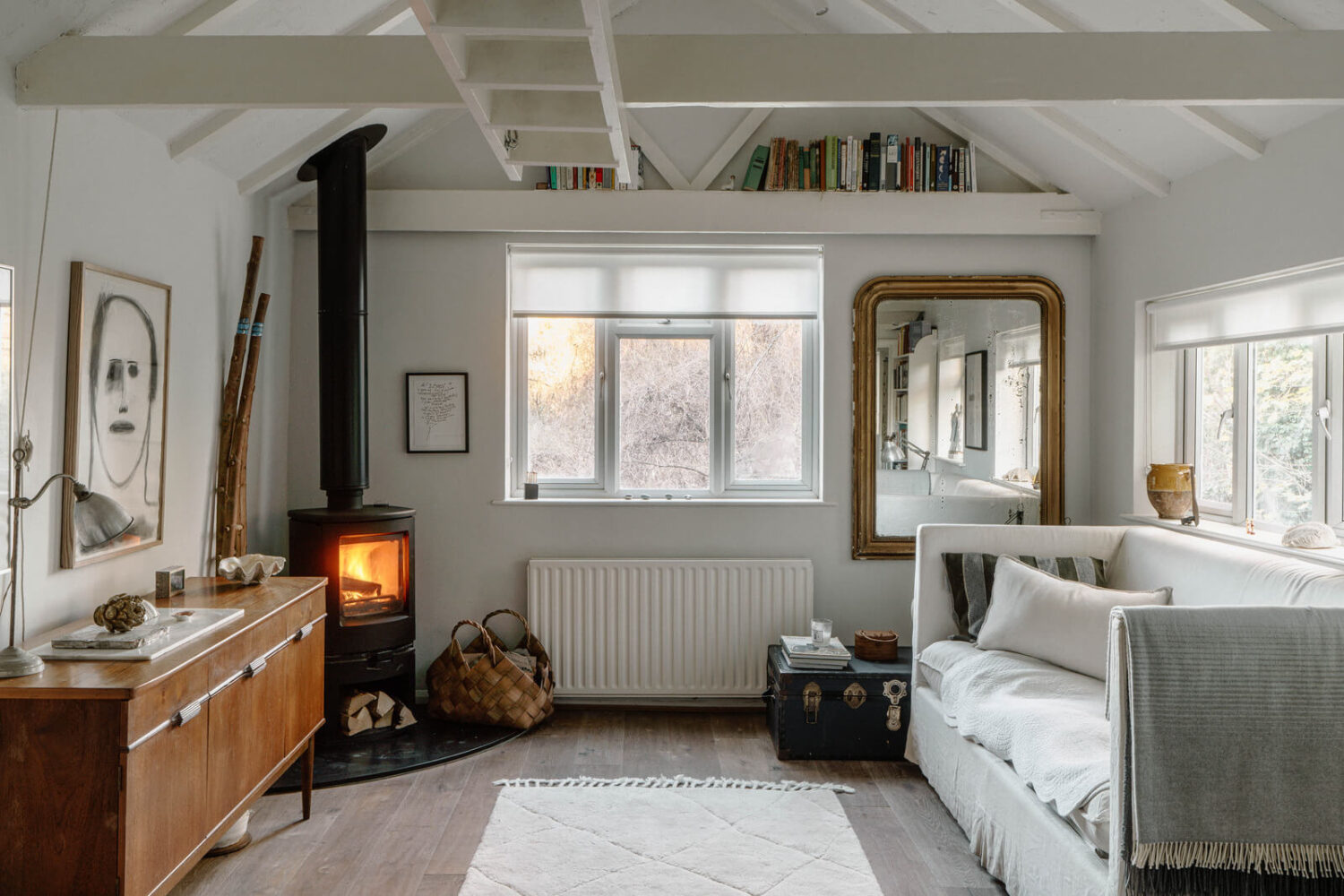 Best of 2024: Loft & Studio Apartments 6 london studio with log burner and bookshelf above window