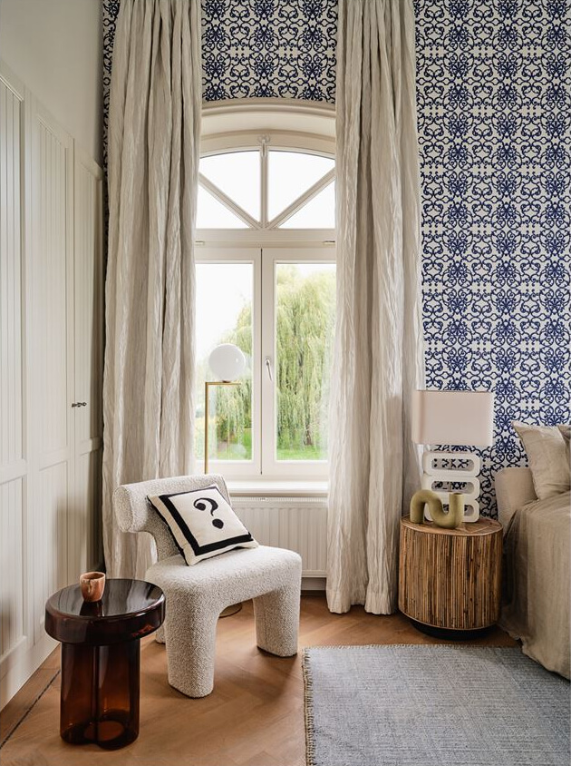 An Amazing Family Home in a Former Dutch Train Station 14 master bedroom with blue wallpaper and built in wardrobes