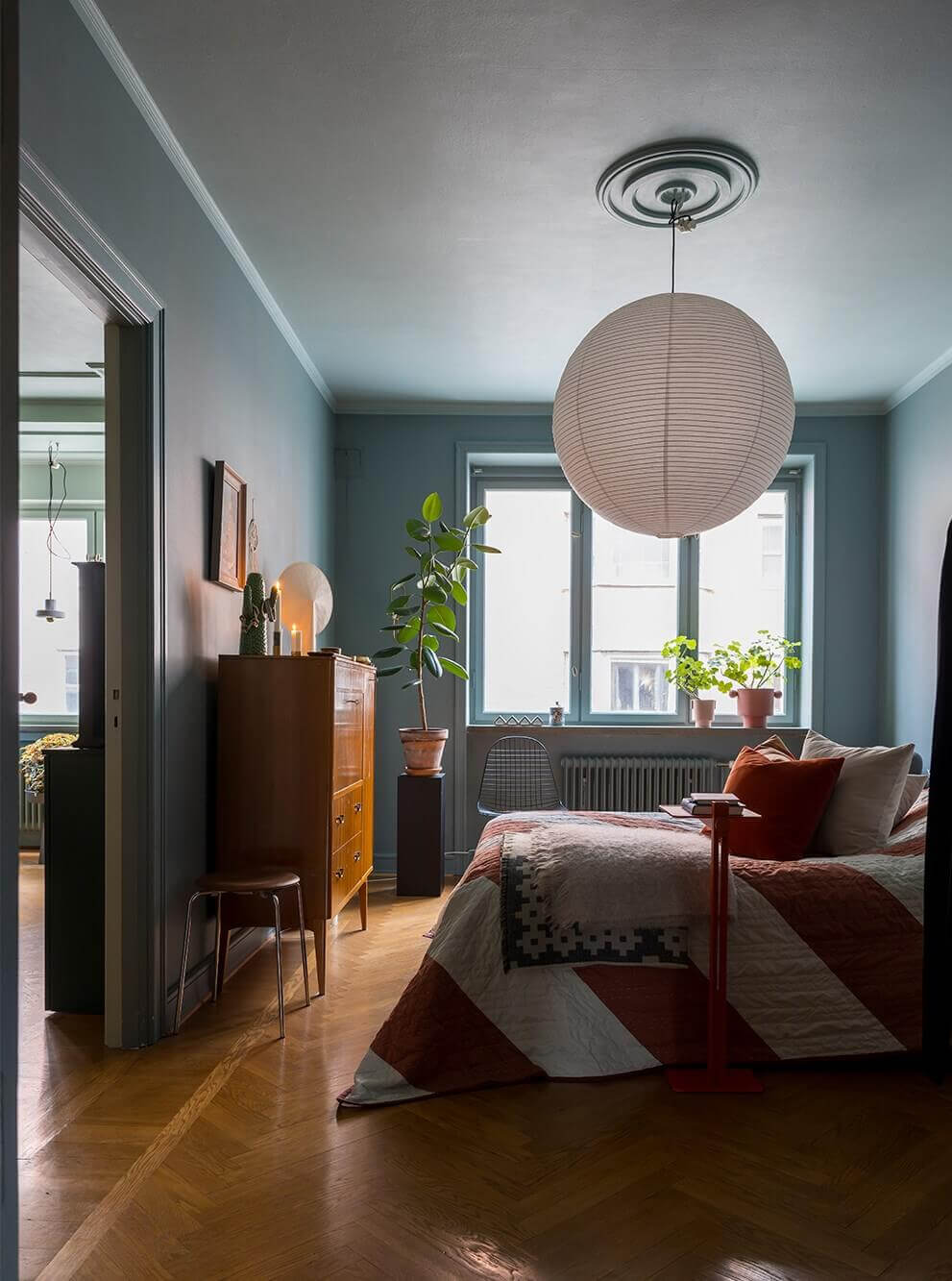An Interior Designer's Moody Apartment with Period Features 13 moody gray bedroom with colorful textiles
