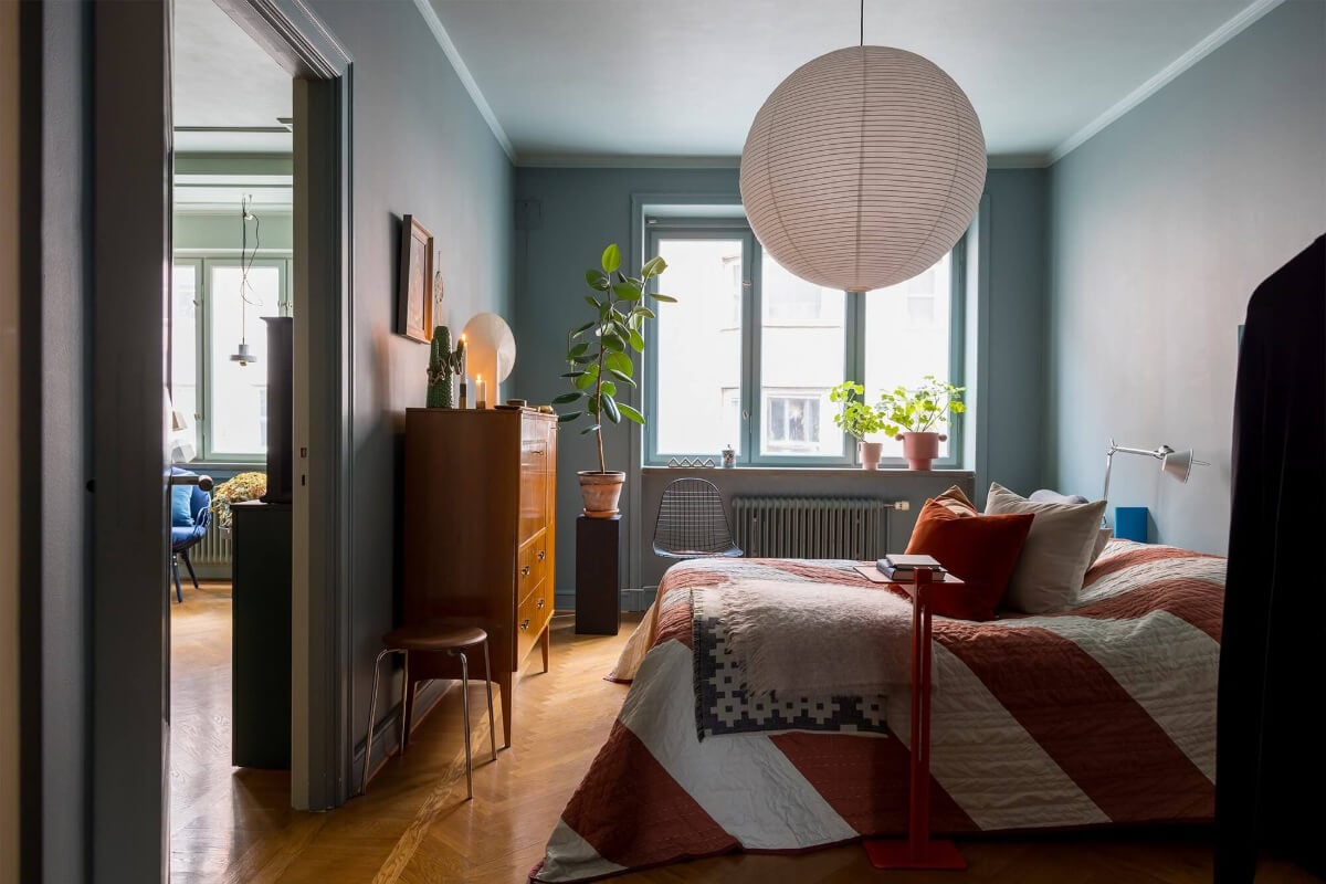 An Interior Designer's Moody Apartment with Period Features 11 muted blue bedroom with wooden floor