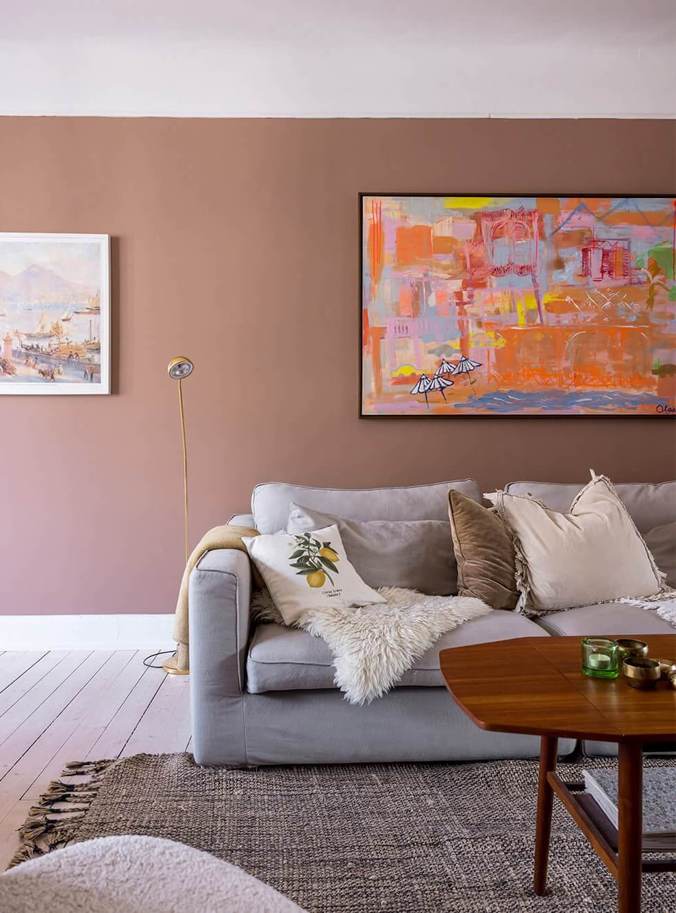 A Spacious Nordic Apartment with a Wonderful Color Palette 4 nordic living room with earthy pink walls and gray couch