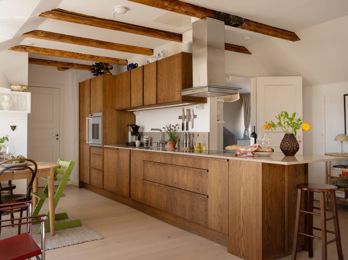 A Charming Light-Filled Attic Apartment with a Dark Oak Kitchen 8 oak kitchen in swedish attic apartment