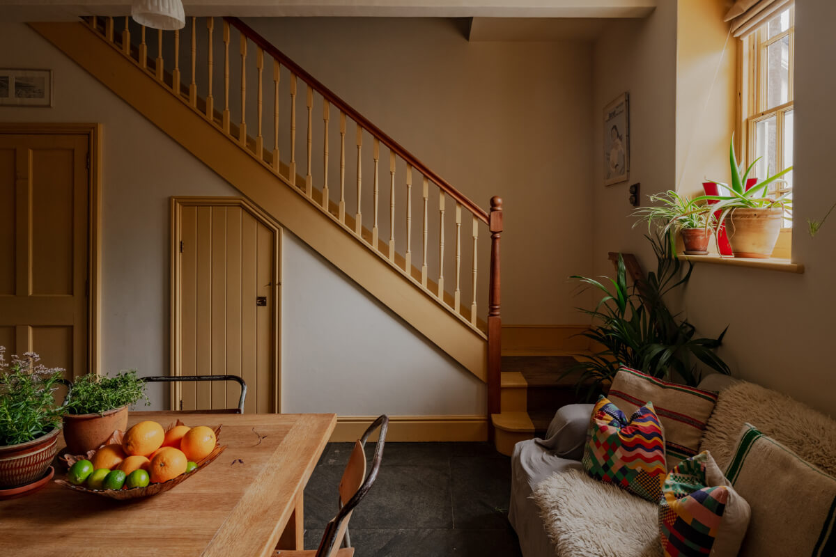 A Strong Color Palette in a Unique Country House in Cornwall 11 ochre yellow staircase
