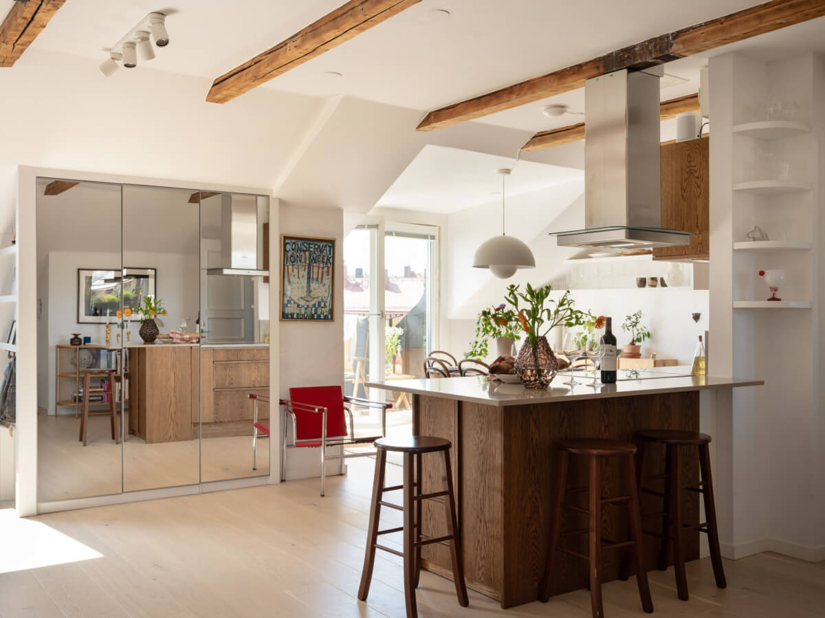 A Charming Light-Filled Attic Apartment with a Dark Oak Kitchen 11 open plan kitchen living room