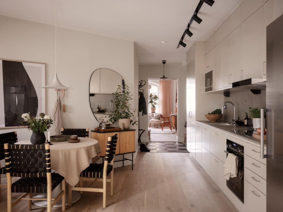 A Calm and Contemporary Apartment in a Former Office Space 8 open plan kitchen space with round dining table
