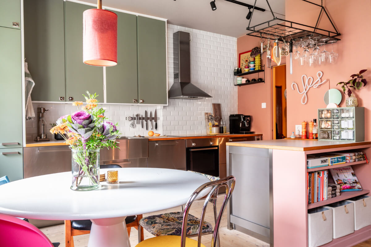 A Vibrant, Colorful Midcentury Apartment in Malmö 8 pink and green kitchen