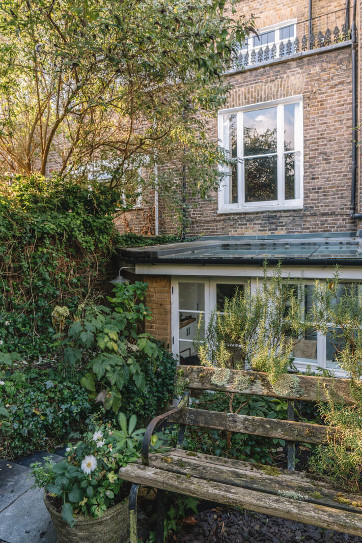 A Charming Garden Apartment in North Kensington 21 plant filled garden with bench