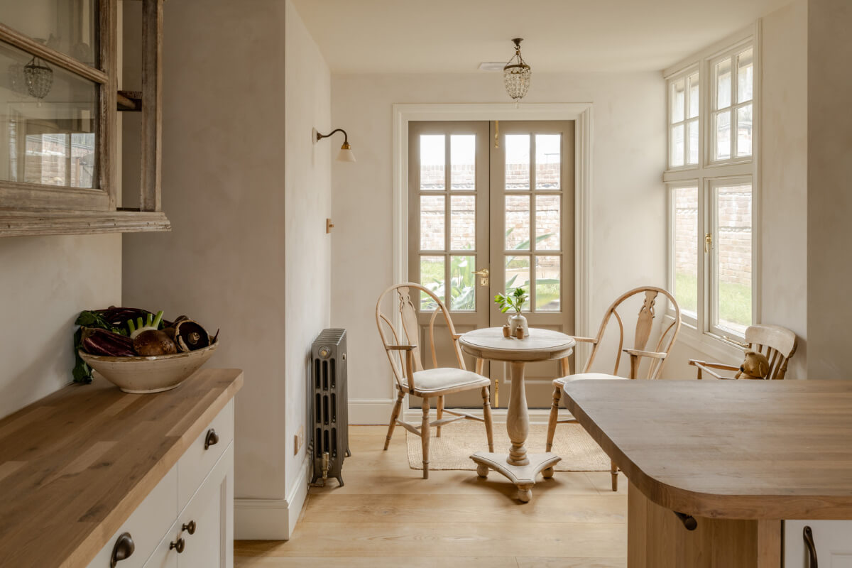 A Light Rustic Farmhouse-Style in an English Cottage 10 rustic farmhouse style kitchen with small round table in english cottage nordroom