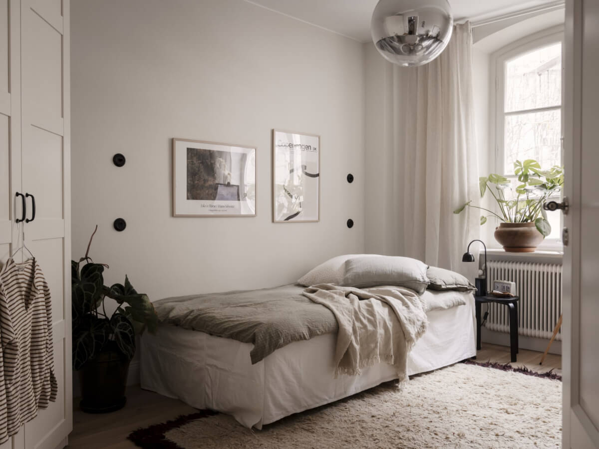 A Calm and Contemporary Apartment in a Former Office Space 19 scandi bedroom with wardrobes
