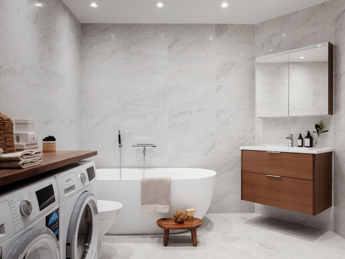 A Calm and Contemporary Apartment in a Former Office Space 22 scandinavian bathroom with bath