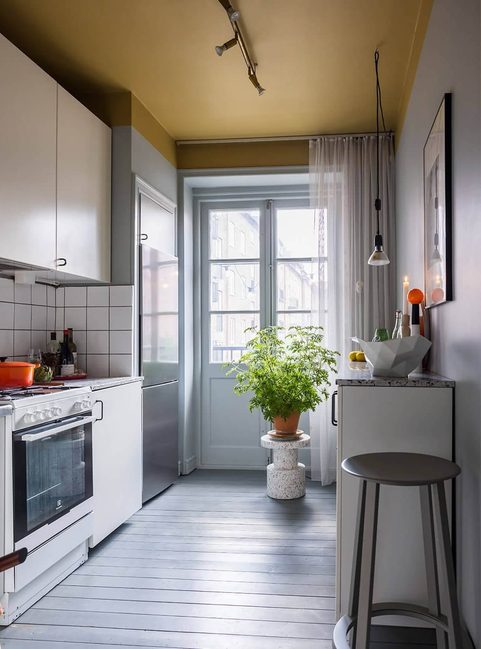 An Interior Designer's Moody Apartment with Period Features 17 simple kitchen with gray walls and floor and ochre yellow ceiling nordroom