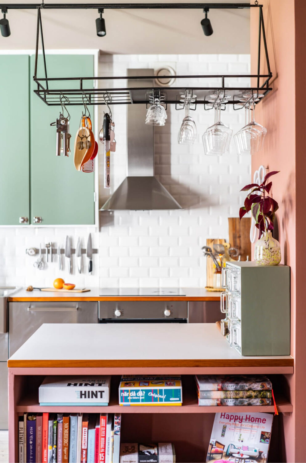 A Vibrant, Colorful Midcentury Apartment in Malmö 14 stainless steel and green kitchen with island