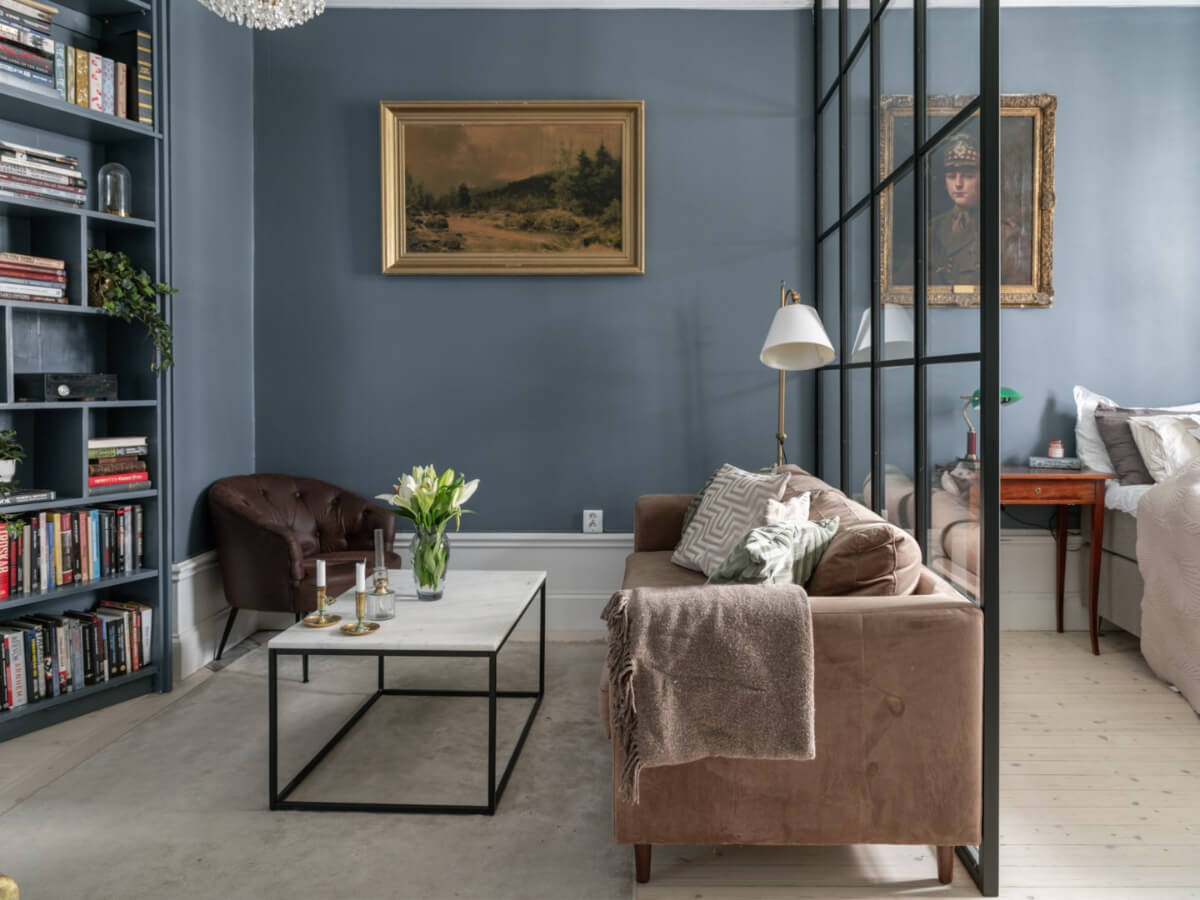Best of 2025: Studio & Loft Apartments 12 studio apartment with gray blue walls and custom bookcase wall nordroom
